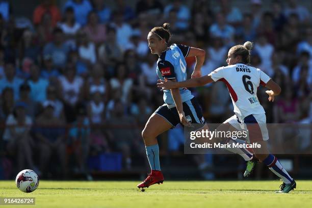 Caitlin Foord of Sydney FC takes on Cassidy Davis of Newcastle Jets during the W-League semi final match between Sydney FC and the Newcastle Jets at...