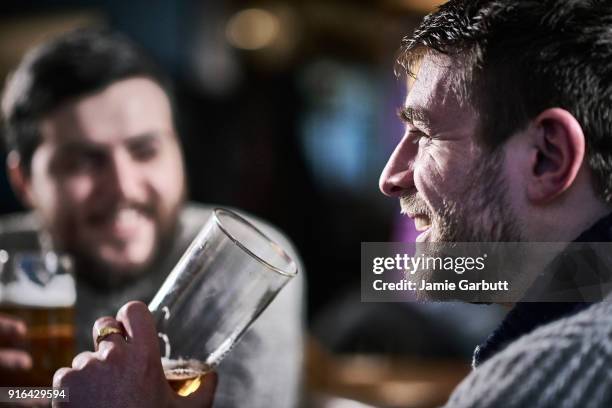 british males drinking a beer in a traditional pub - pub mates stock pictures, royalty-free photos & images