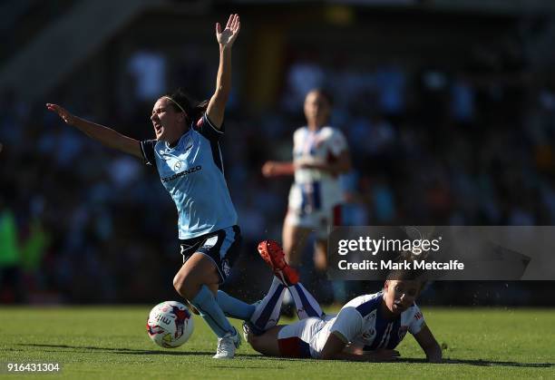 Lisa De Vanna of Sydney FC is tackled by Hannah Brewer of Newcastle Jets who received a red card for challenge during the W-League semi final match...