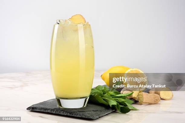 lemonade with mint and ginger - ginger glasses stock-fotos und bilder