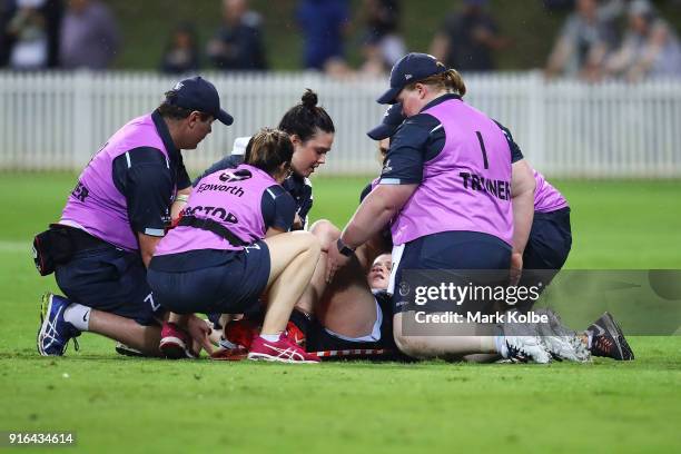 Brianna Davey of the Blues receives attention from the trainers during the round 20 AFLW match between the Greater Western Sydney Giants and the...