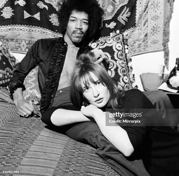 American singer and guitarist Jimi Hendrix with girlfriend Kathy Etchingham in his Mayfair flat, London, 7th January 1969.