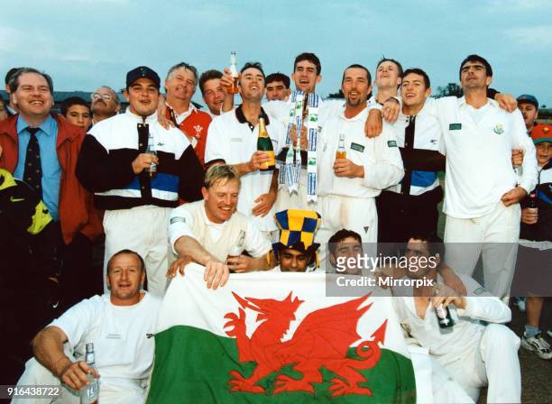 Glamorgan celebrate their championship with trophy, champagne - and the national flag. Glamorgan v Somerset County Championship match held at Taunton...