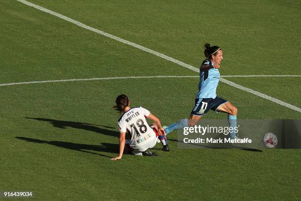 Lisa De Vanna of Sydney FC is tackled by Clare Wheeler of Newcastle Jets during the W-League semi final match between Sydney FC and the Newcastle...