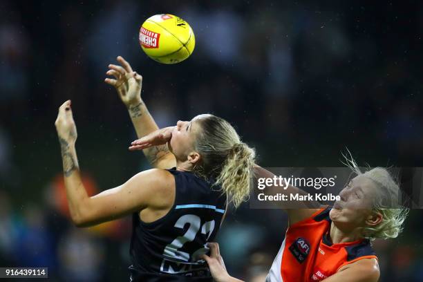 Tayla Harris of the Blues attempts to mark under pressure from Renee Tomkins of the Giants during the round 20 AFLW match between the Greater Western...