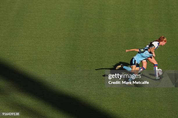 Victoria Huster of Newcastle Jets and Chloe Logarzo of Sydney FC compete for the ball during the W-League semi final match between Sydney FC and the...