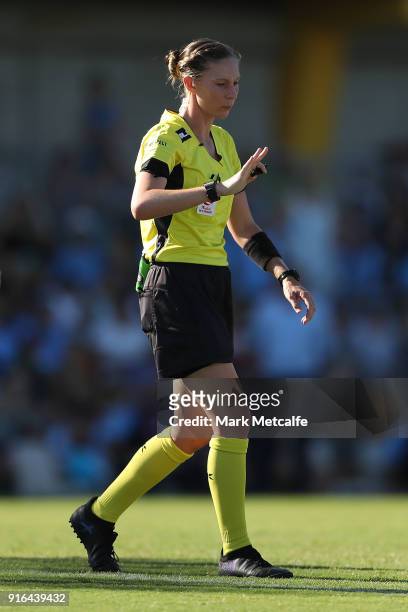 Referee Lara Lee prepares to give Hannah Brewer of Newcastle Jets a red card following a challenge on Lisa De Vanna of Sydney FC during the W-League...