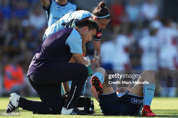 Caitlin Foord of Sydney FC is treated for an injury during the W-League semi final match between Sydney FC and the Newcastle Jets at Leichhardt Oval...