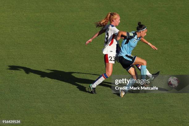 Victoria Huster of Newcastle Jets and Chloe Logarzo of Sydney FC compete for the ball during the W-League semi final match between Sydney FC and the...