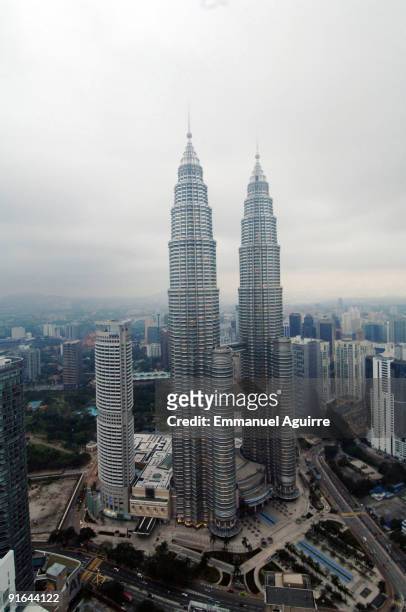 French climber Alain Robert, aka "Spiderman", climbs one of the Petronas Twin Towers on September 1, 2009 in Kuala Lumpur, Malaysia. Robert climbed...