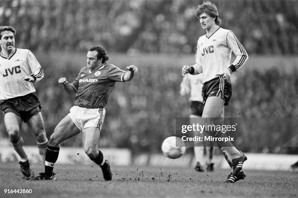 Manchester United 2-0 Arsenal, Old Division One, Old Trafford, January 24th 1987. Terry Gibson challenges Arsenal's Kenny Sansom as Tony Adams looks...