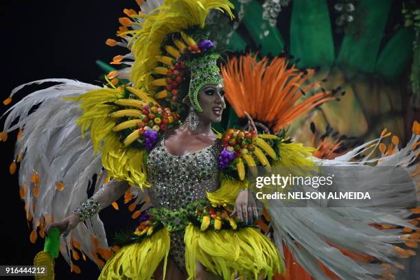 Reveller of the Rosas de Ouro samba school performs during the first night of carnival in Sao Paulo, Brazil, at the city's Sambadrome early on...