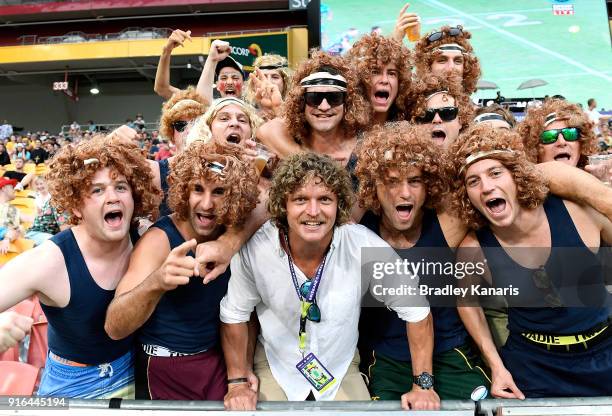 Former Australian Wallabies player Nick Cummins poses for a photo with a group of his fans during the 2018 Global Tens at Suncorp Stadium on February...