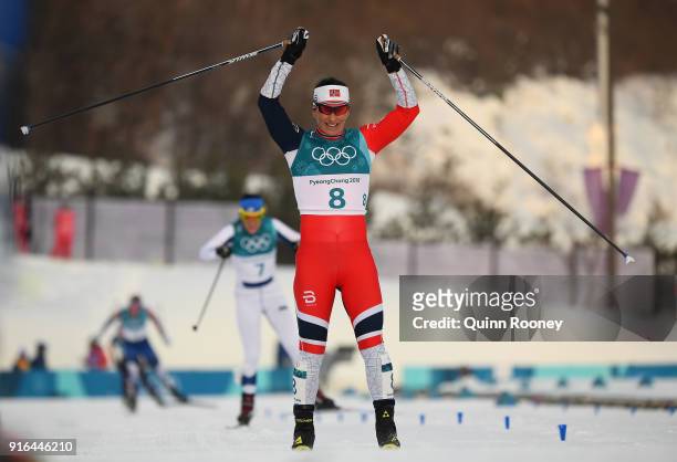 Marit Bjoergen of Norway celebrates crossing the finish line to win silver during the Ladies Cross Country Skiing 7.5km + 7.5km Skiathlon on day one...