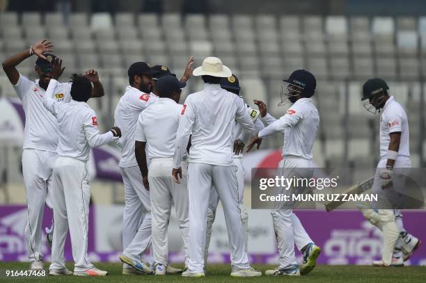 Sri Lanka cricketers celebrate after the dismissal of the Bangladesh cricketer Sabbir Rahman during the third day of the second cricket Test between...