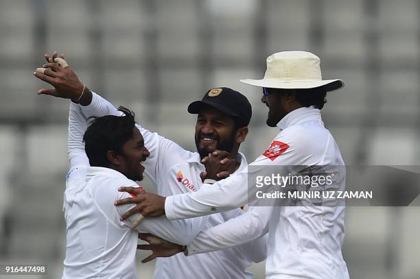 Sri Lanka cricketer Akila Dananjaya celebrates with his teammates after the dismissal of the Bangladesh cricketer Sabbir Rahman as his teammate...