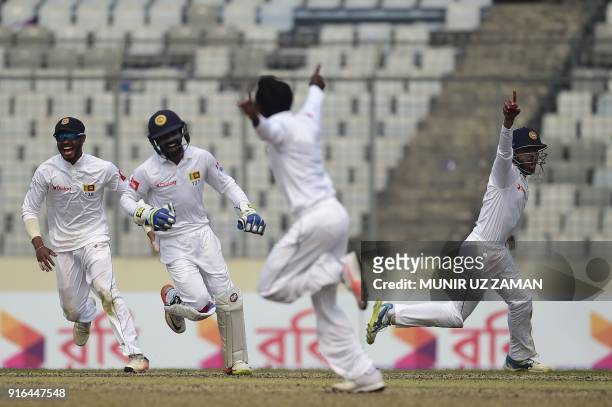 Sri Lanka cricketer Kusal Mendis celebrates with his teammates after the dismissal of the Bangladesh cricketer Sabbir Rahman as his teammate...