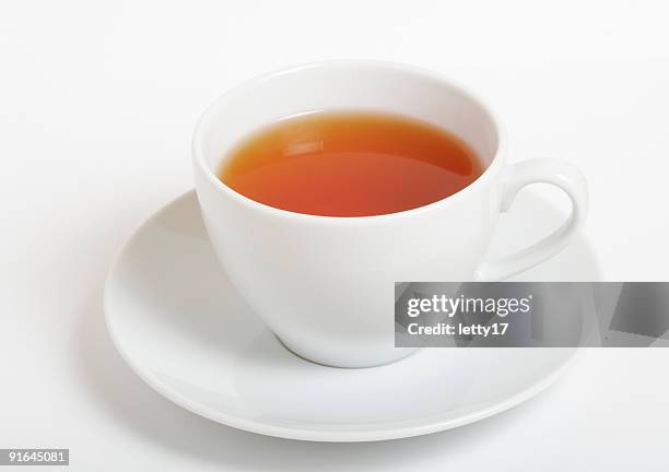 tazza di tè nero - tazza foto e immagini stock