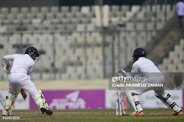 Sri Lanka wicketkeeper Niroshan Dickwella successfully breaks the stumps of the Bangladesh cricketer Mushfiqur Rahim during the third day of the...