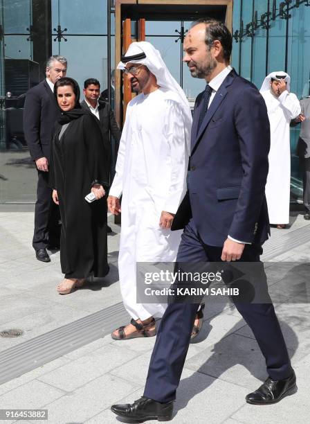 French Prime Minister Edouard Philippe walks with Abu Dhabi Crown Prince Mohammed bin Zayed Al-Nahyan during a visit to the Louvre Abu Dhabi Museum...