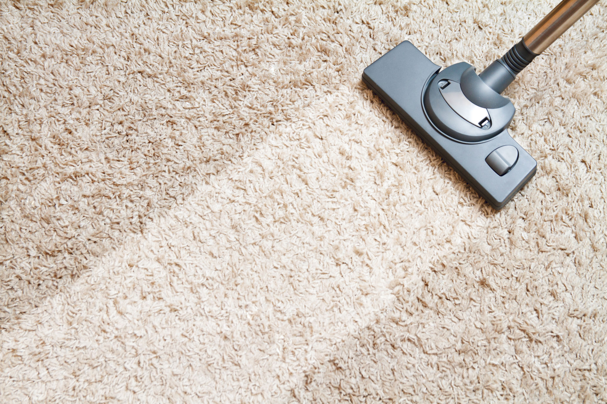 vacuuming carpet