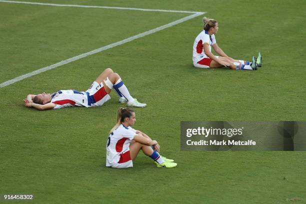 Newcastle Jets players look dejected after defeat in the W-League semi final match between Sydney FC and the Newcastle Jets at Leichhardt Oval on...