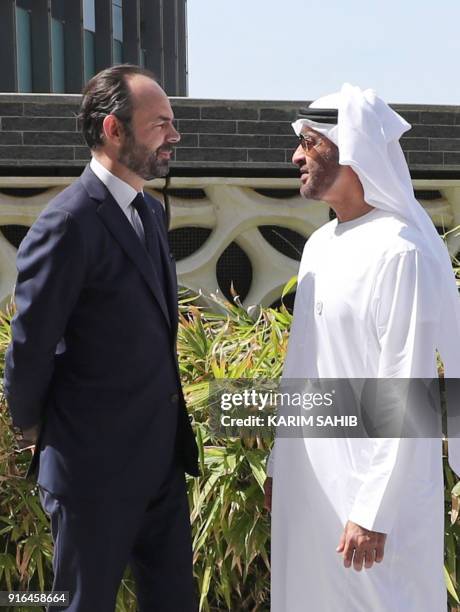 French Prime Minister Edouard Philippe speaks to Abu Dhabi's Crown Prince Mohammed bin Zayed Al-Nahyan during a visit to the Gulf emirate's Louvre...