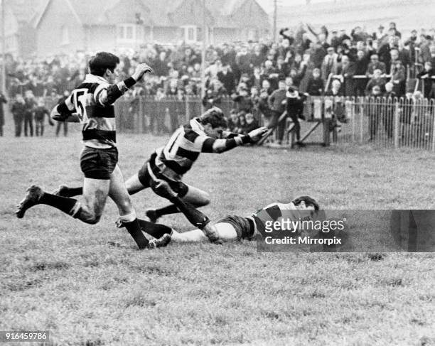 Newport winger Stuart Watkins pouncing for his 100th try for Newport to help beat Cardiff at Rodney Parade, 11th November 1968.