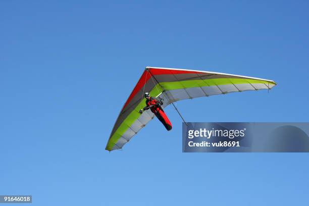 hangglider in action(grobnik-croatia) - hang glider stock pictures, royalty-free photos & images