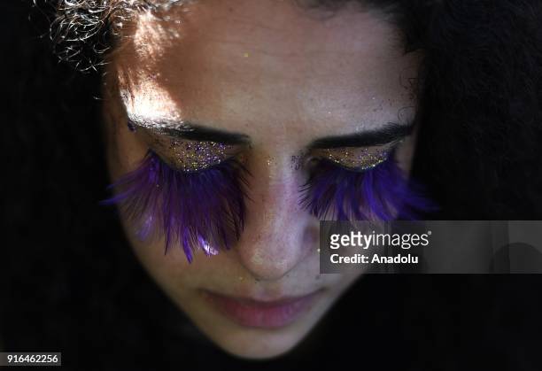 People attend the street carnival parade during annual block party "Carmelitas", in Santa Teresa district of Rio de Janeiro, Brazil on February 9,...