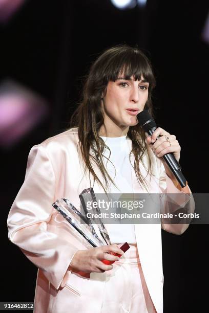 French Singeringer Juliette Armanet delivers a speech after she received the best newcomer album award as she stands next to French Tv host Daphne...
