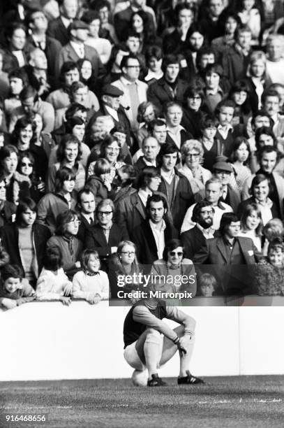 English League Division One match at Upton Park. West Ham 0 v Derby County 0. Bobby Moore sitting on the ball watched by Hammers fans, 27th October...