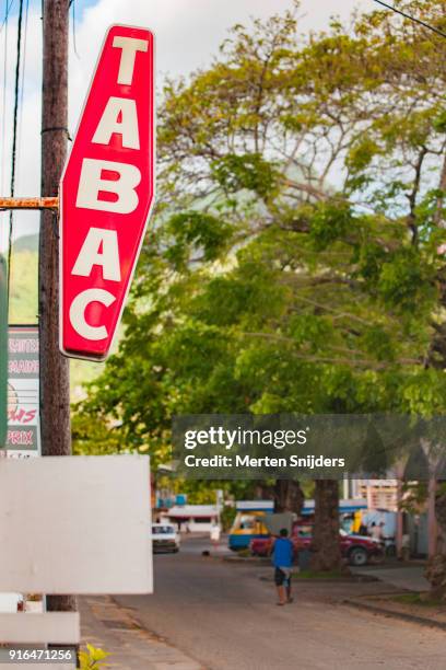 iconic carotte french tabac neon sign at ocean front - carotte stock-fotos und bilder