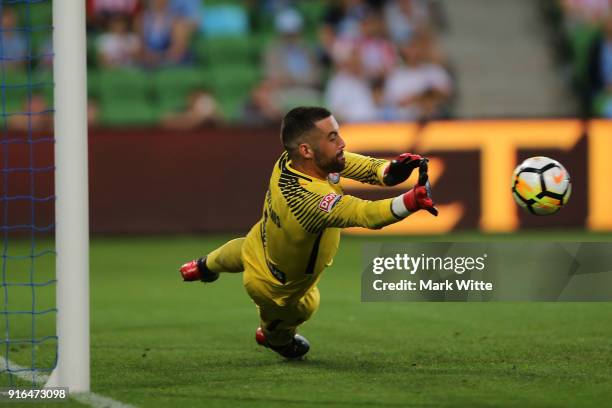 Dean Bouzanis of Melbourne City dives to save a penalty during the round 20 A-League match between Melbourne City and Sydney FC at AAMI Park on...