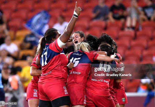 The Queensland Reds celebrate victory after defeating the New South Wales Blues in the Women's Grand Final match during the 2018 Global Tens at...