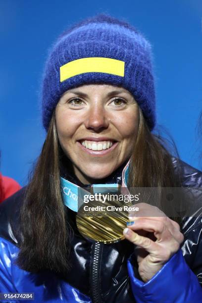 Gold medalist Charlotte Kalla of Sweden celebrates during the Medal Ceremony for the Cross-Country Skiing Ladies' 7.5km + 7.5km Skiathlon on day one...