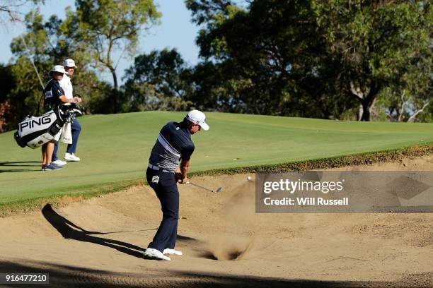 Brett Rumford of Australia plays out of the bunker on the 18th hole during day three of the World Super 6 at Lake Karrinyup Country Club on February...