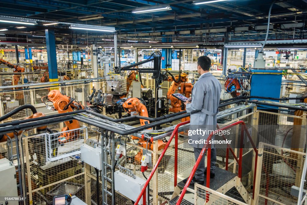 Engineer Factory Integration Factory Engineer Inspecting The Work Process High-Res Stock Photo ...