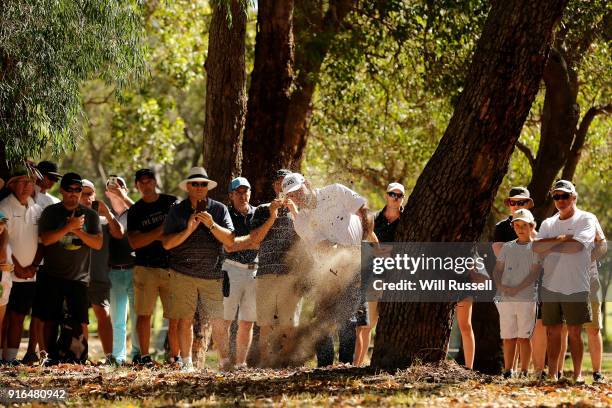 Lee Westwood of England plays his second shot from the rough on the 14th hole during day three of the World Super 6 at Lake Karrinyup Country Club on...