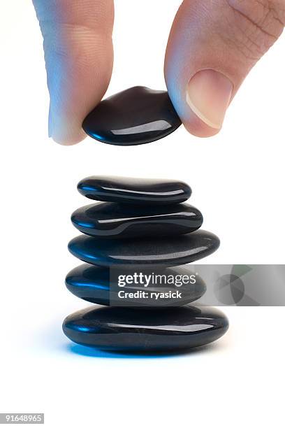 Man Stacking Rocks Man Stacking Rocks Photos and Premium High Res Pictures - Getty Images