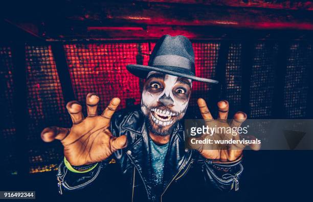 spooky skeleton man having fun celebrating halloween - stage costume stock pictures, royalty-free photos & images