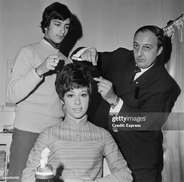 British pop singer and actress Helen Shapiro with hairdresser John Spence and his son Roy, UK, 18th March 1968.