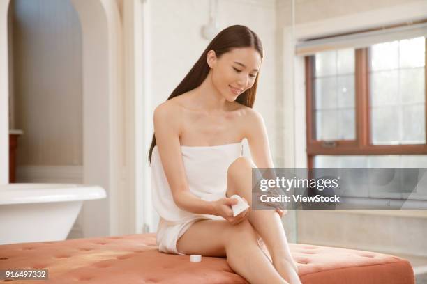 young women in the bathroom - sunken bath stock pictures, royalty-free photos & images