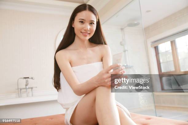 young women in the bathroom - sunken bath stock pictures, royalty-free photos & images