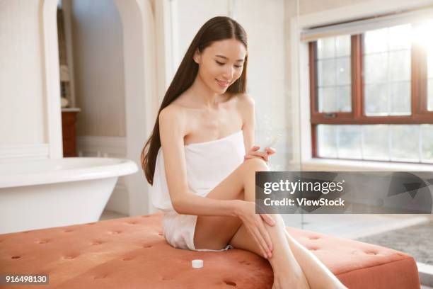 young women in the bathroom - sunken bath stock pictures, royalty-free photos & images