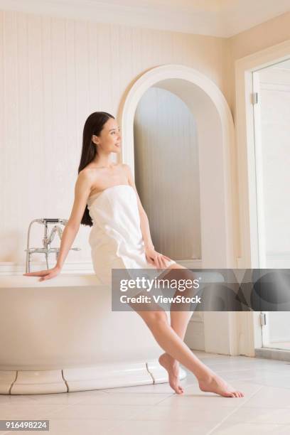 young women in the bathroom - sunken bath stock pictures, royalty-free photos & images