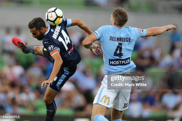 Alex Brosque of Sydney FC goes to head the ball infront of Harrison Delbridge of Melbourne City during the round 20 A-League match between Melbourne...