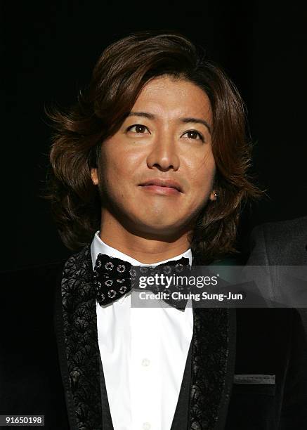 Actor Takuya Kimura attends at the photocall for the Gala Presentation 'I Come with the Rain' during the 14th Pusan International Film Festival at...