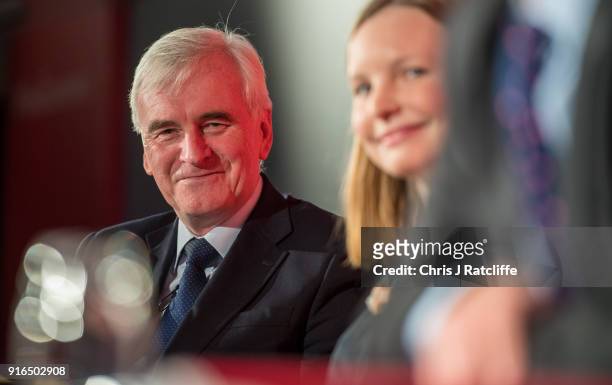 Shadow Chancellor John McDonnell sits on a panel after speaking to an audience at a Labour Party conference on alternative models of ownership on...