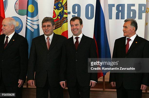 Secretary Sergey Lebedev, Moldova's President Mihay Gimpu, Russian President Dmitry Medvedev and Tajik Prime Minister Akil Akilov pose for a group...